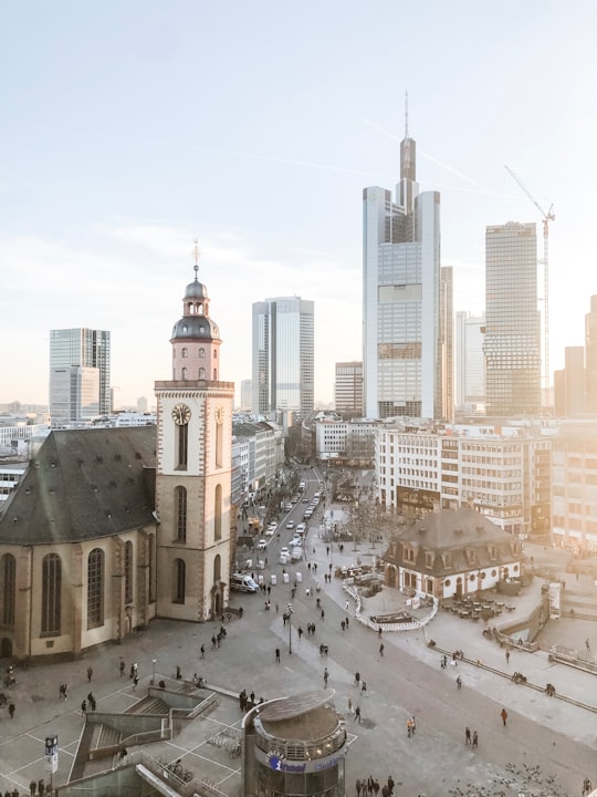 group of people near city buildings in Frankfurt am Main Germany