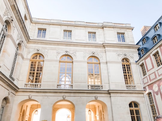 beige building during daytime in Palace of Versailles France