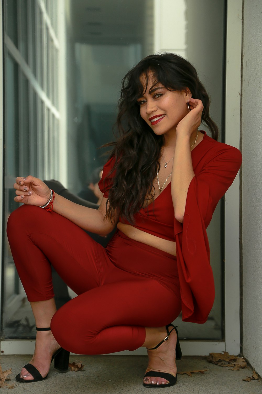 smiling woman wearing red dress