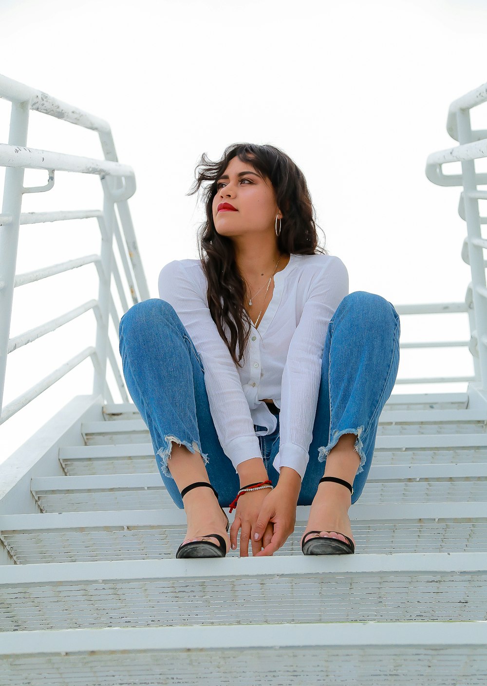 women wearing blue pants close-up photography