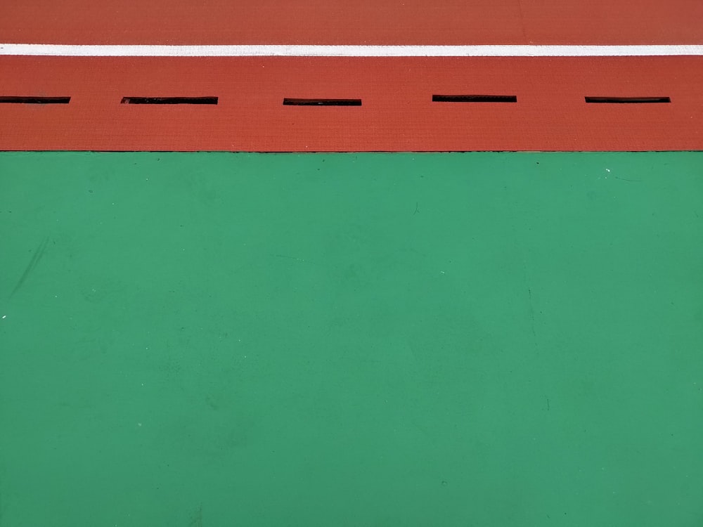 a close up of a tennis racket on a court