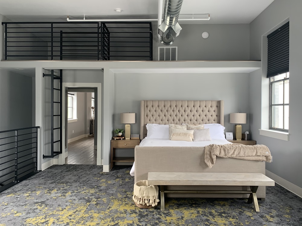 white and brown bed near window in a room