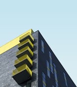 yellow and black building under blue sky during daytime