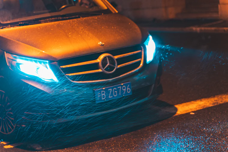 Mercedes saloon travelling along an open road between Polish cities