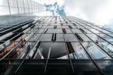 low angle photo of curtain glass wall building