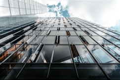 low angle photo of curtain glass wall building