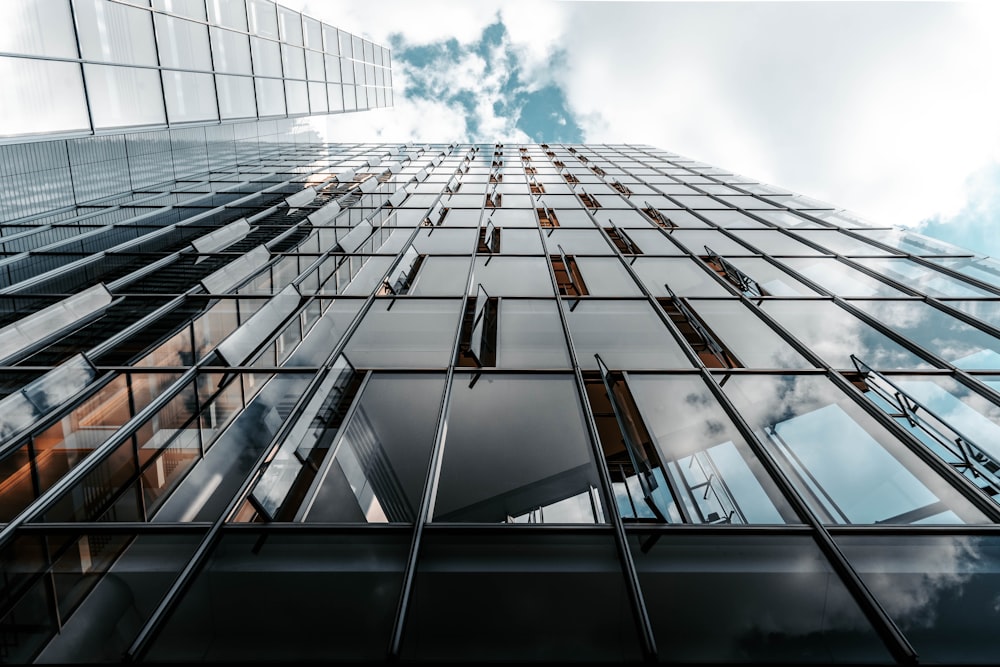 low angle photo of curtain glass wall building