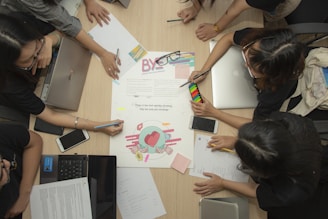 people having meeting beside table