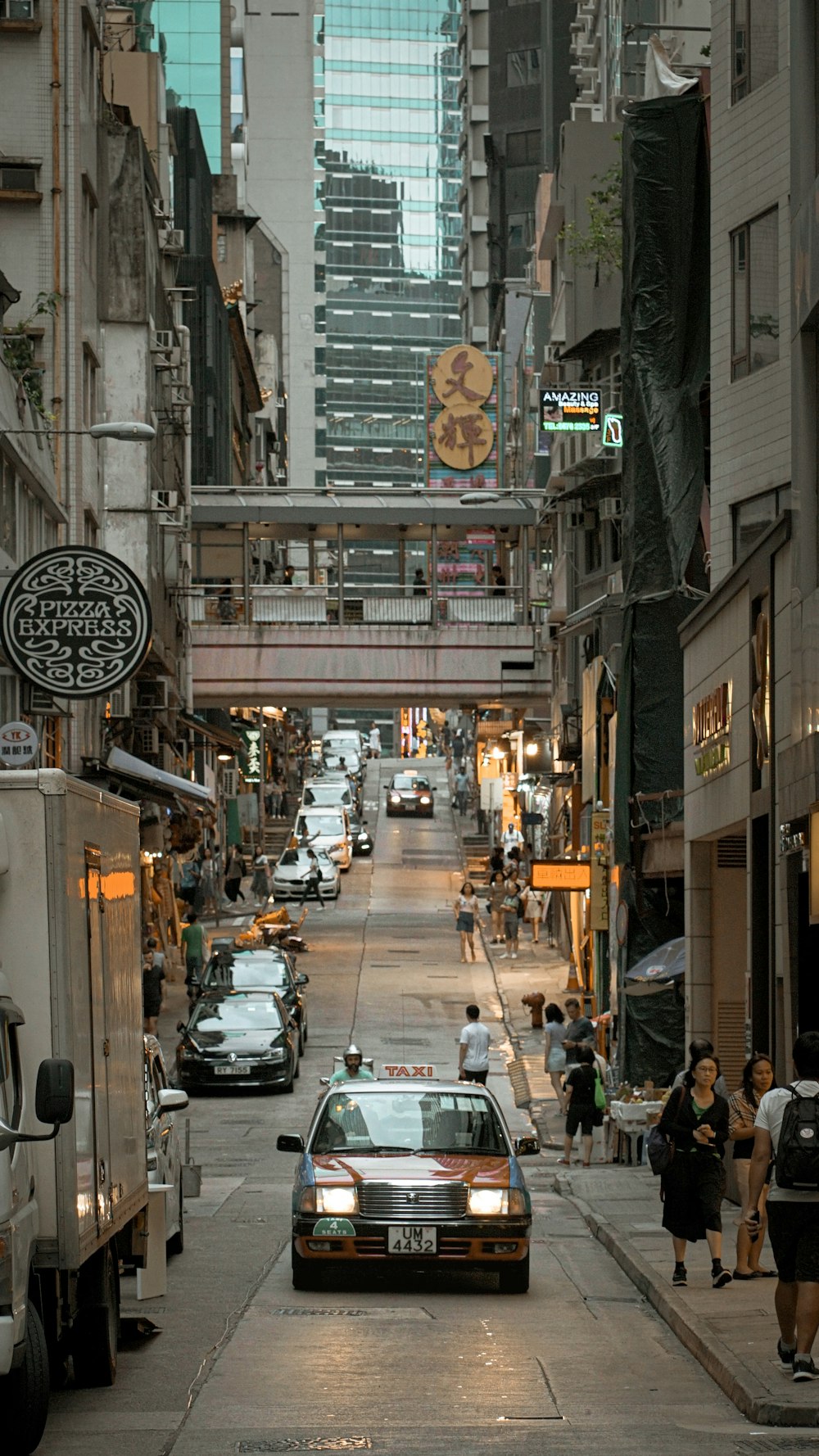 car passing by on road under buildings