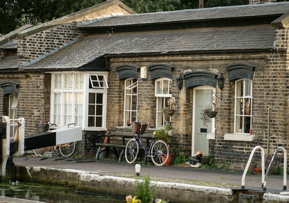 bicycle parked beside house