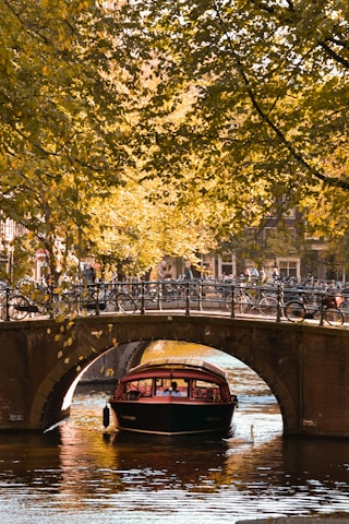 boat passing under river