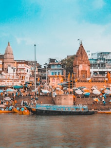 boat beside stairs and building