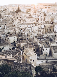 Historic stone streets of Cáceres bathed in warm afternoon light.
