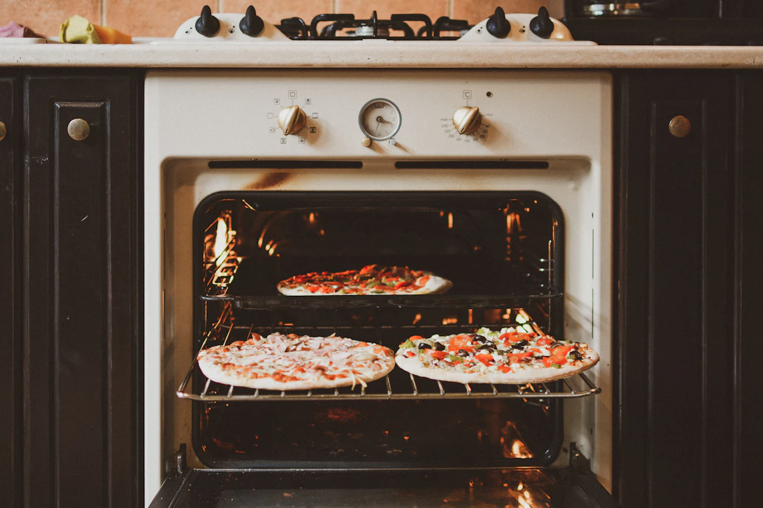 An oven up to temperature with the interior glowing warm