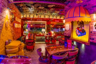 A cozy restaurant interior with vibrant red, yellow, and black decor