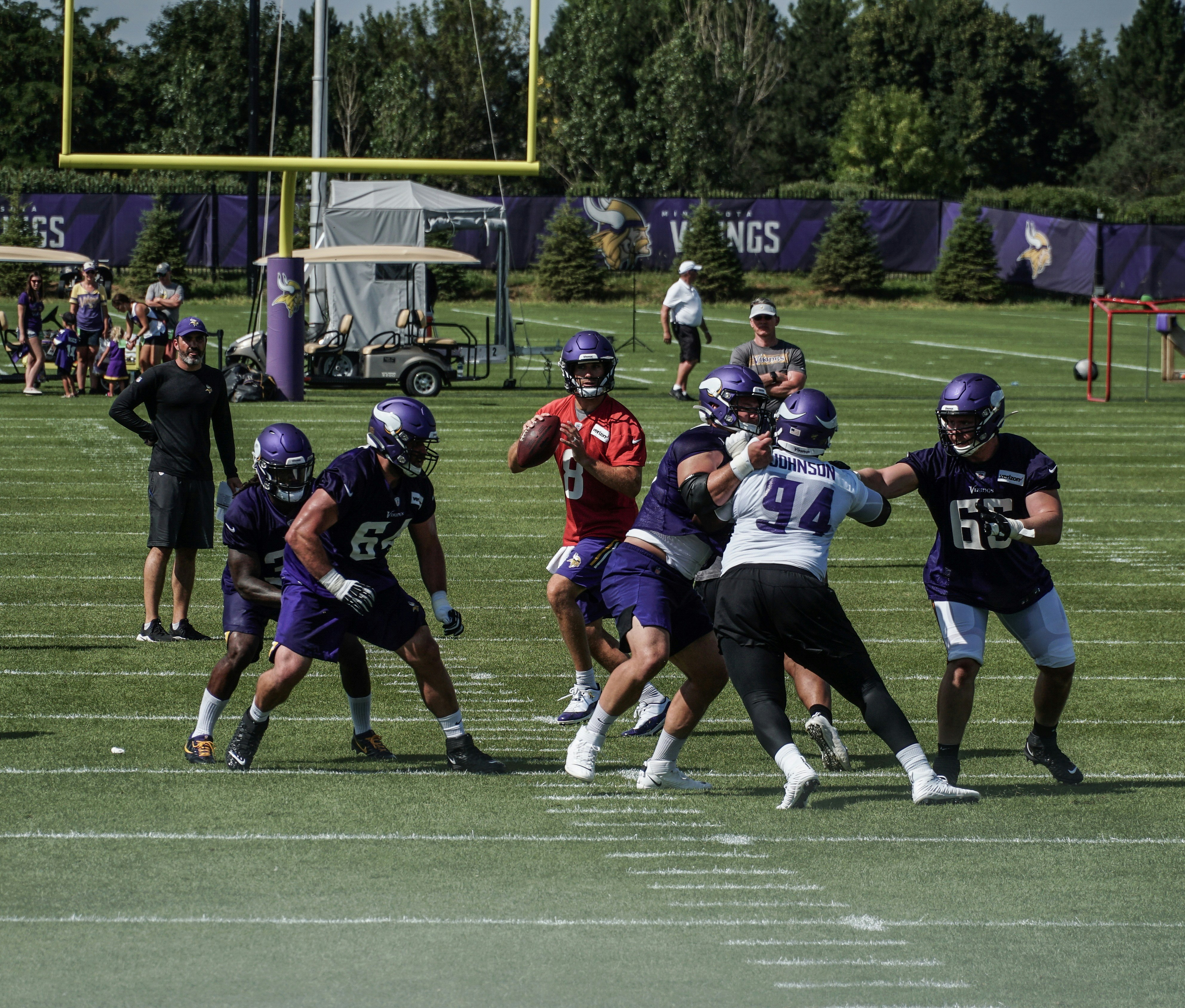 group of people playing football during daytime