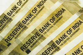 Several strips of Indian currency notes featuring the text 'RESERVE BANK OF INDIA' repeated across them.