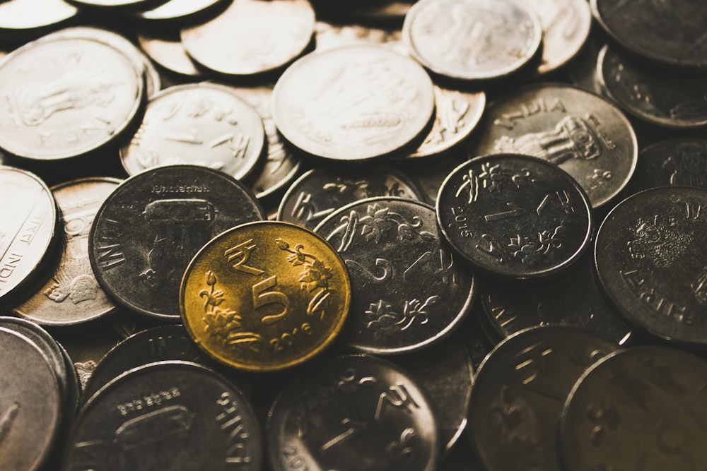 round silver-colored coin collection close-up photography