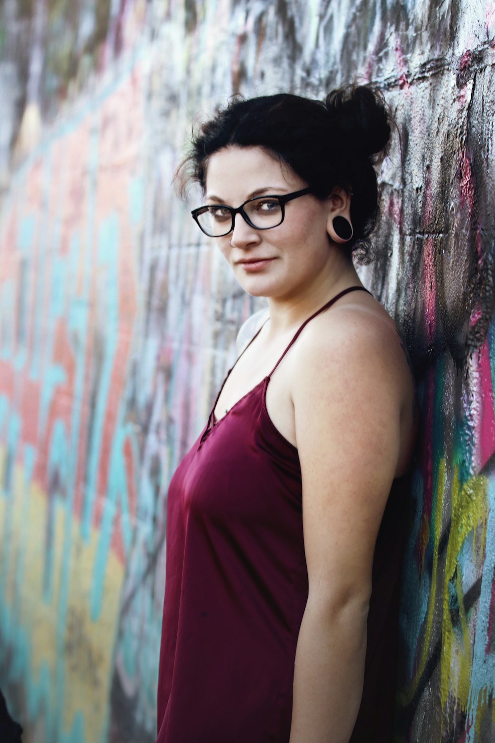 women's maroon spaghetti strap top close-up photography