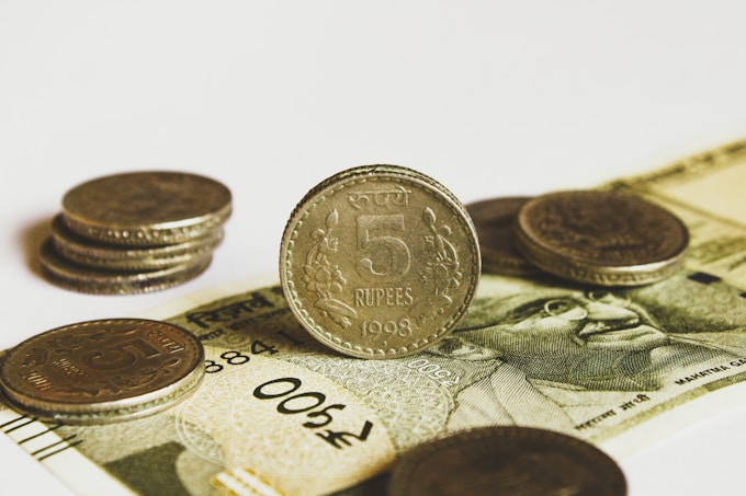 Detailed view of Indian Rupee currency, illustrating the financial context for economic analysis 