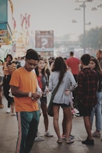 A busy event scene with people using handy talkies.