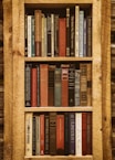 book in brown wooden book shelf