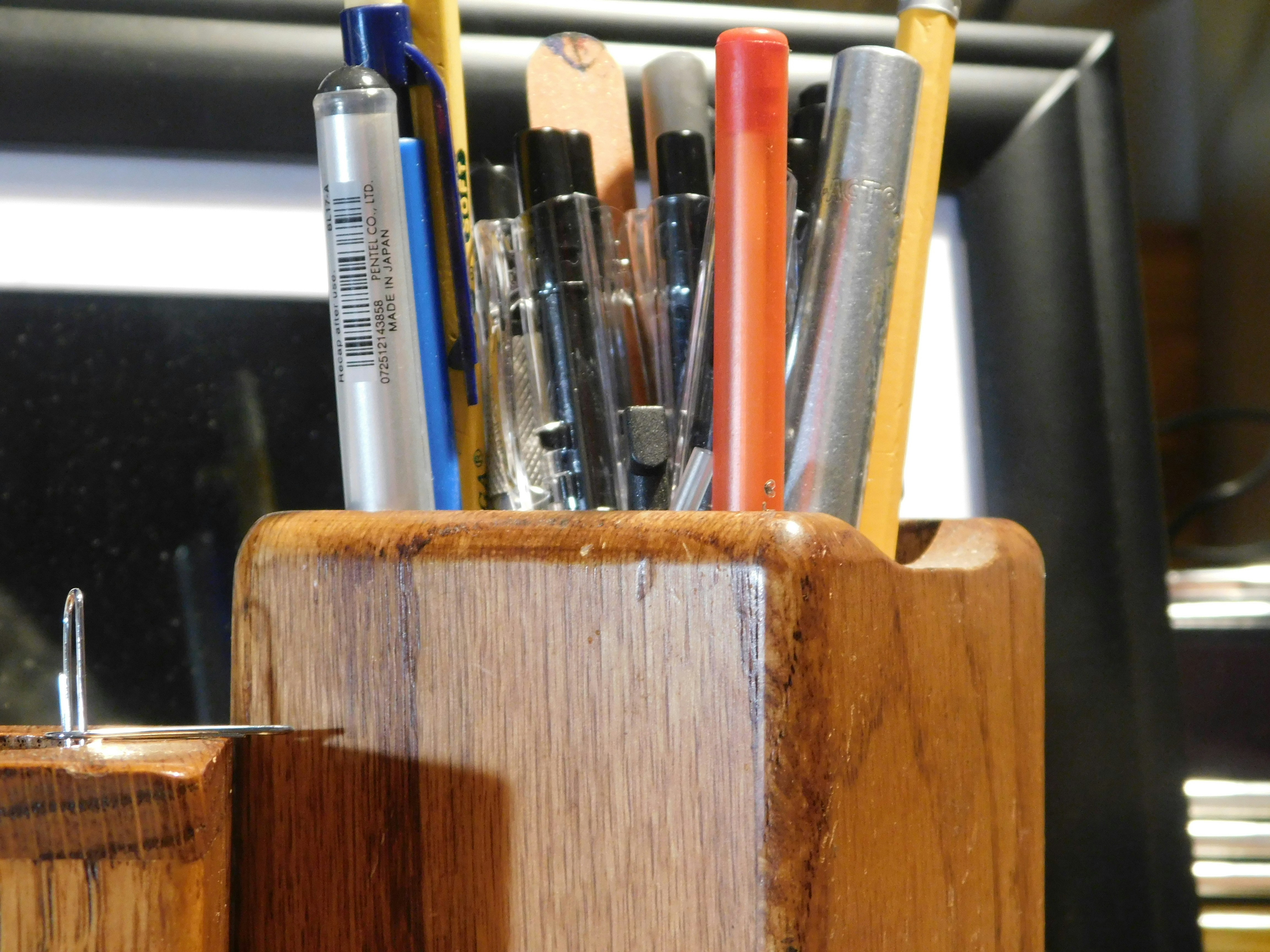Solid wood desk organizer with compartments for pens, notebooks, and office supplies