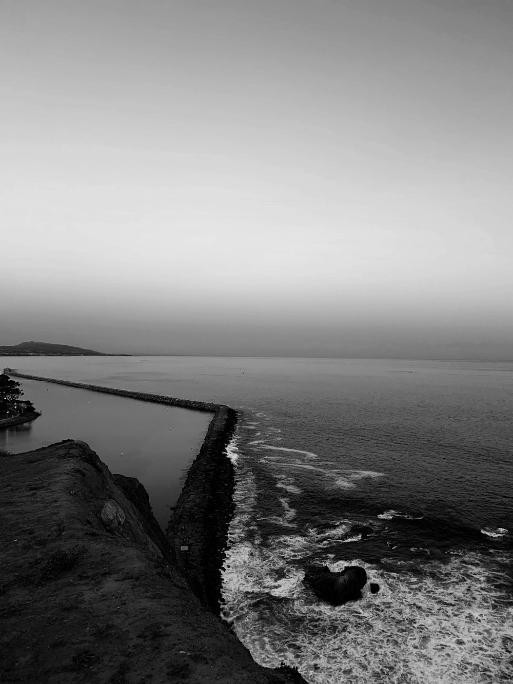 a black and white photo of a body of water