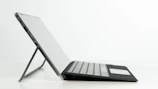 Side view of a laptop highlighting its slim profile and modern keyboard.