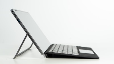 Portable professional workstation laptop with magnesium alloy chassis in a modern office.