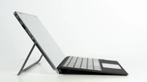 Side view of a laptop highlighting its slim profile and modern keyboard.