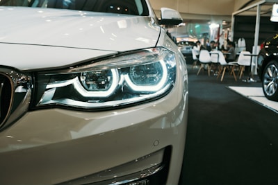 a close up of a car on a showroom floor