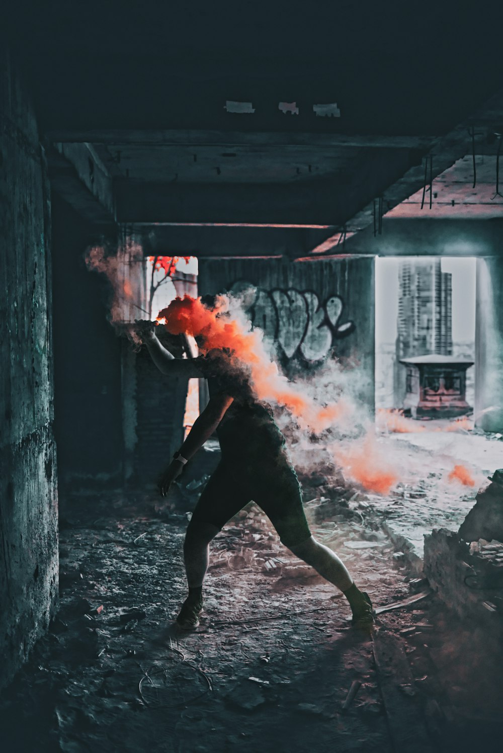 man walking towards building wall