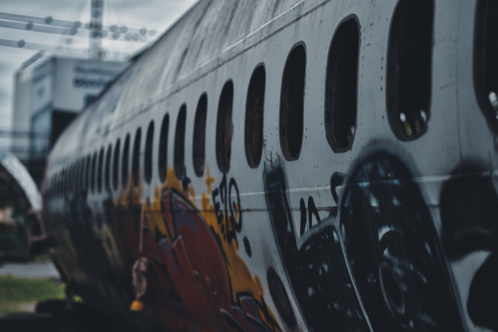 a close up of the side of a bus with graffiti on it