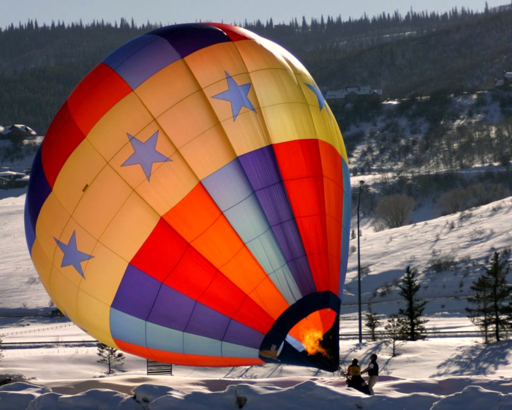 two person holding hot air balloon