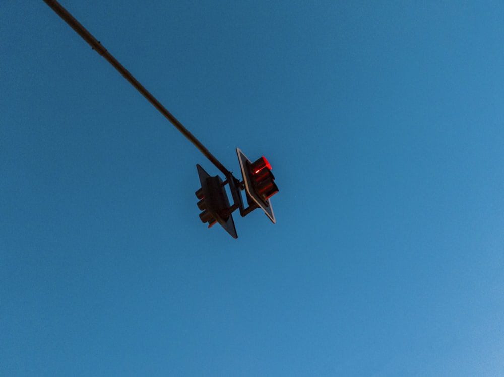 a traffic light with a blue sky in the background