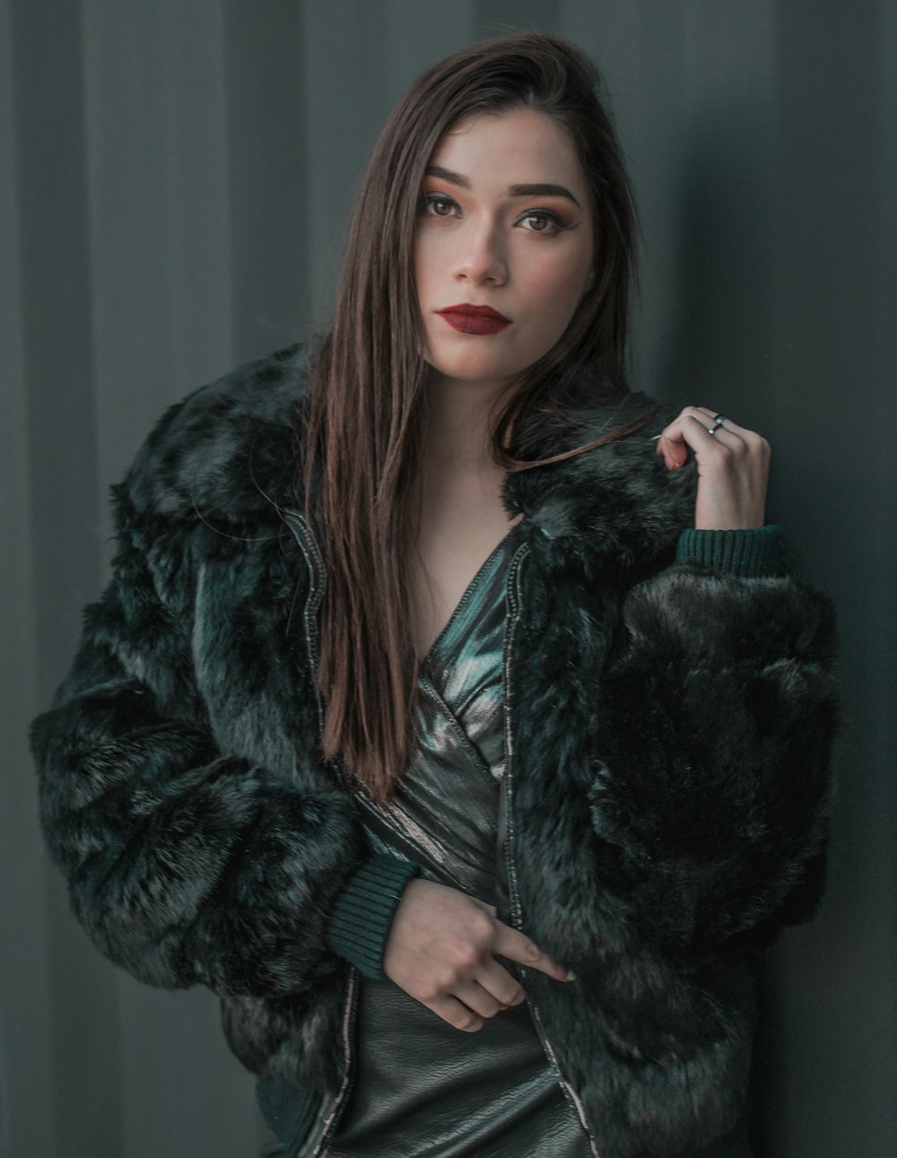 woman wearing green fur jacket