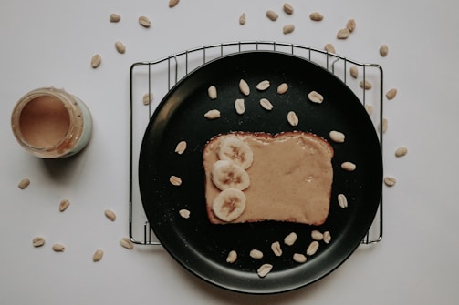 A spread of creamy peanut butter and honey on toast.