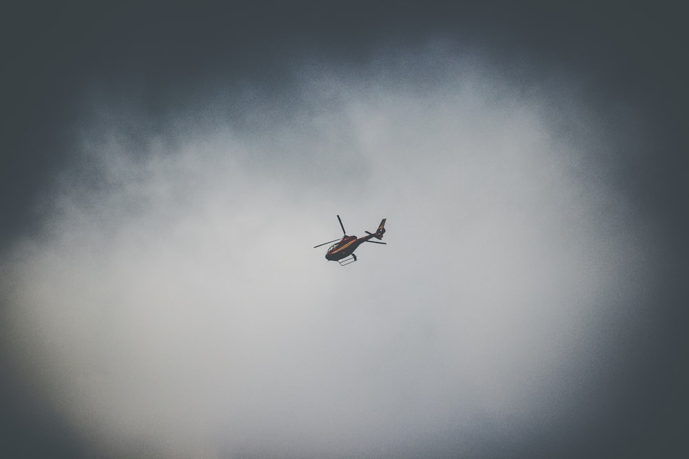 flying black and brown helicopter