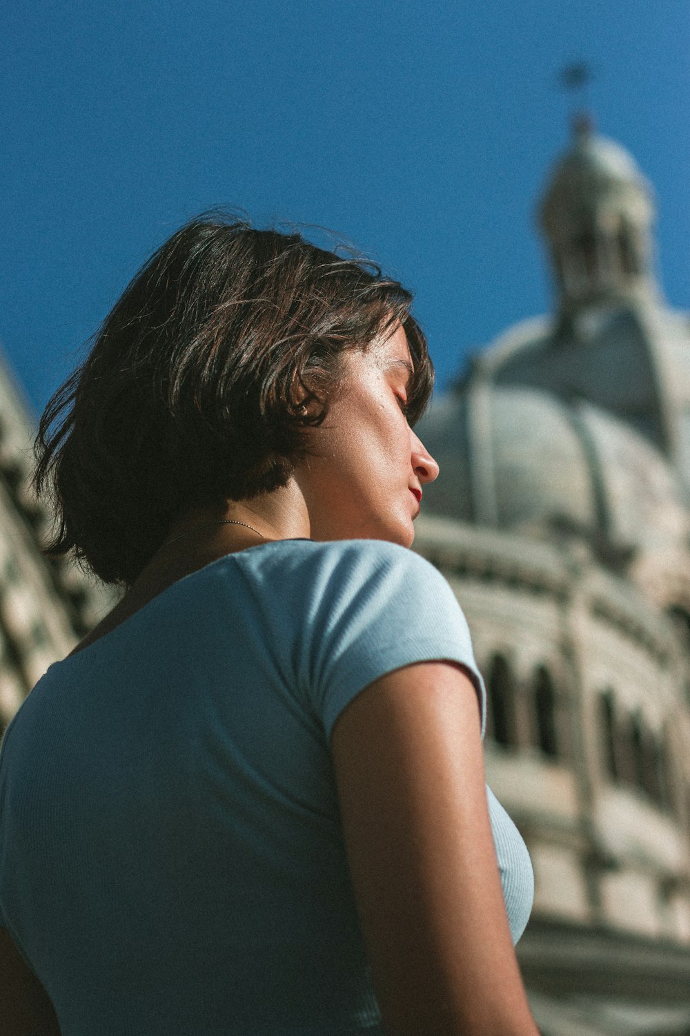 woman standing outside church building