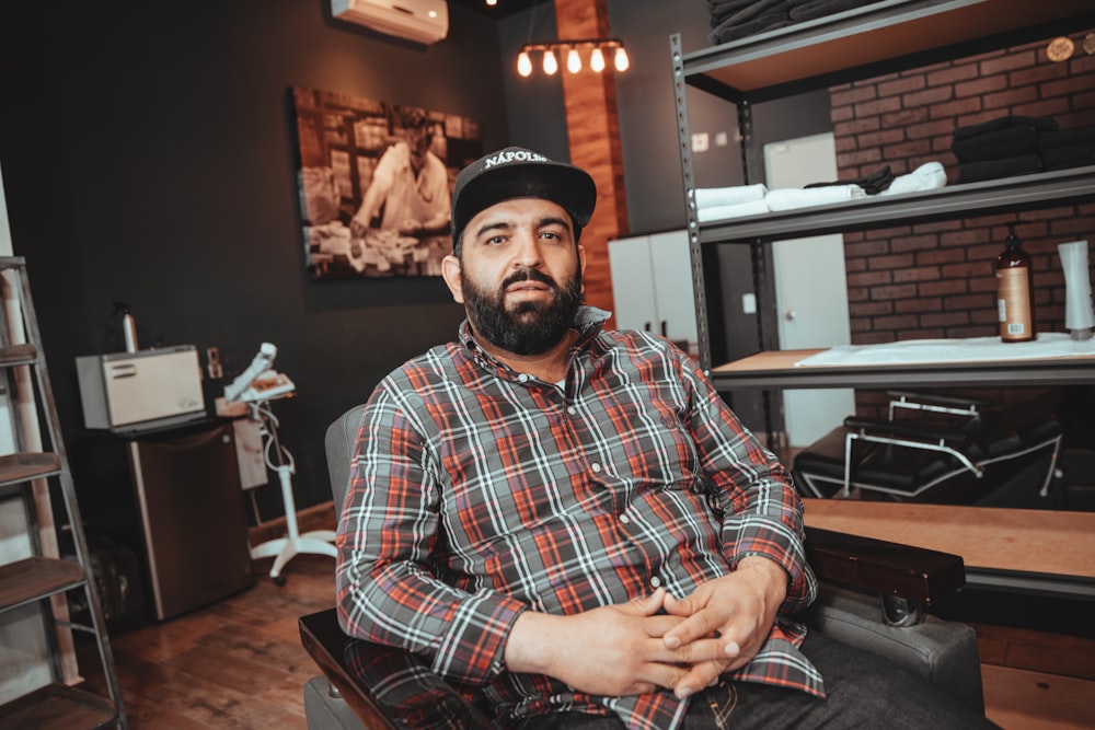 man sitting on armchair