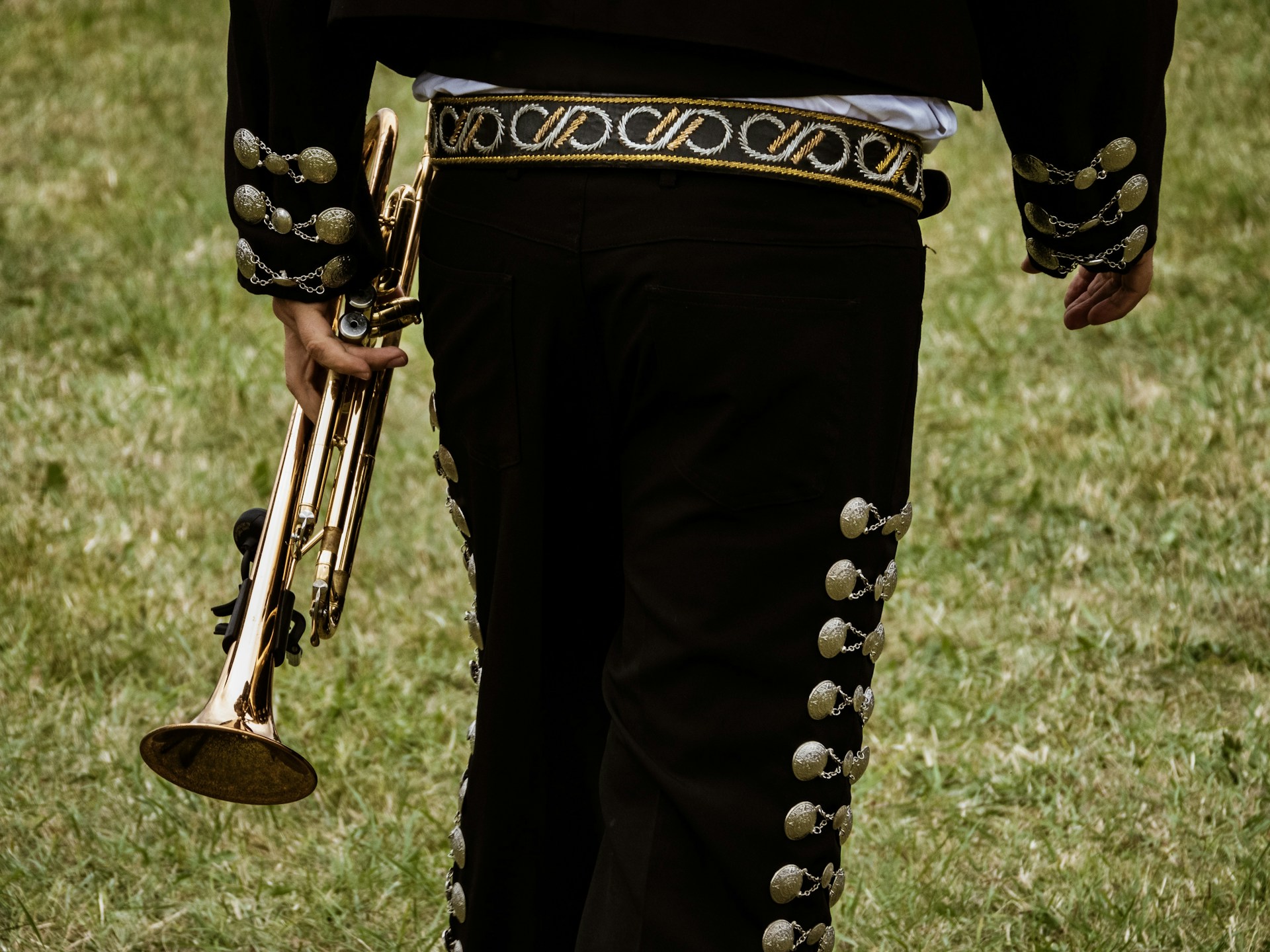 close-up photography of person holding trombone
