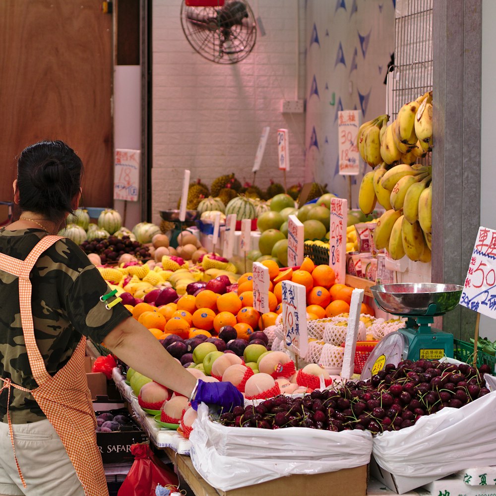 woman vending assorted fruits