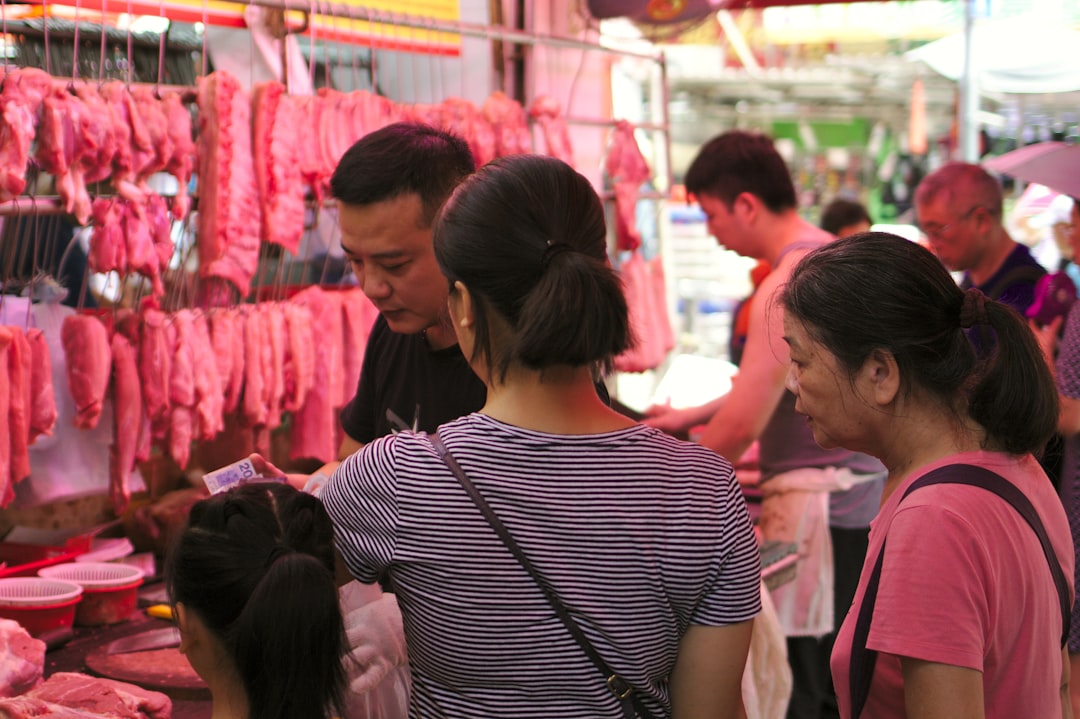 two women buying meat