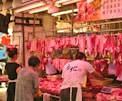 man and woman vending raw meats