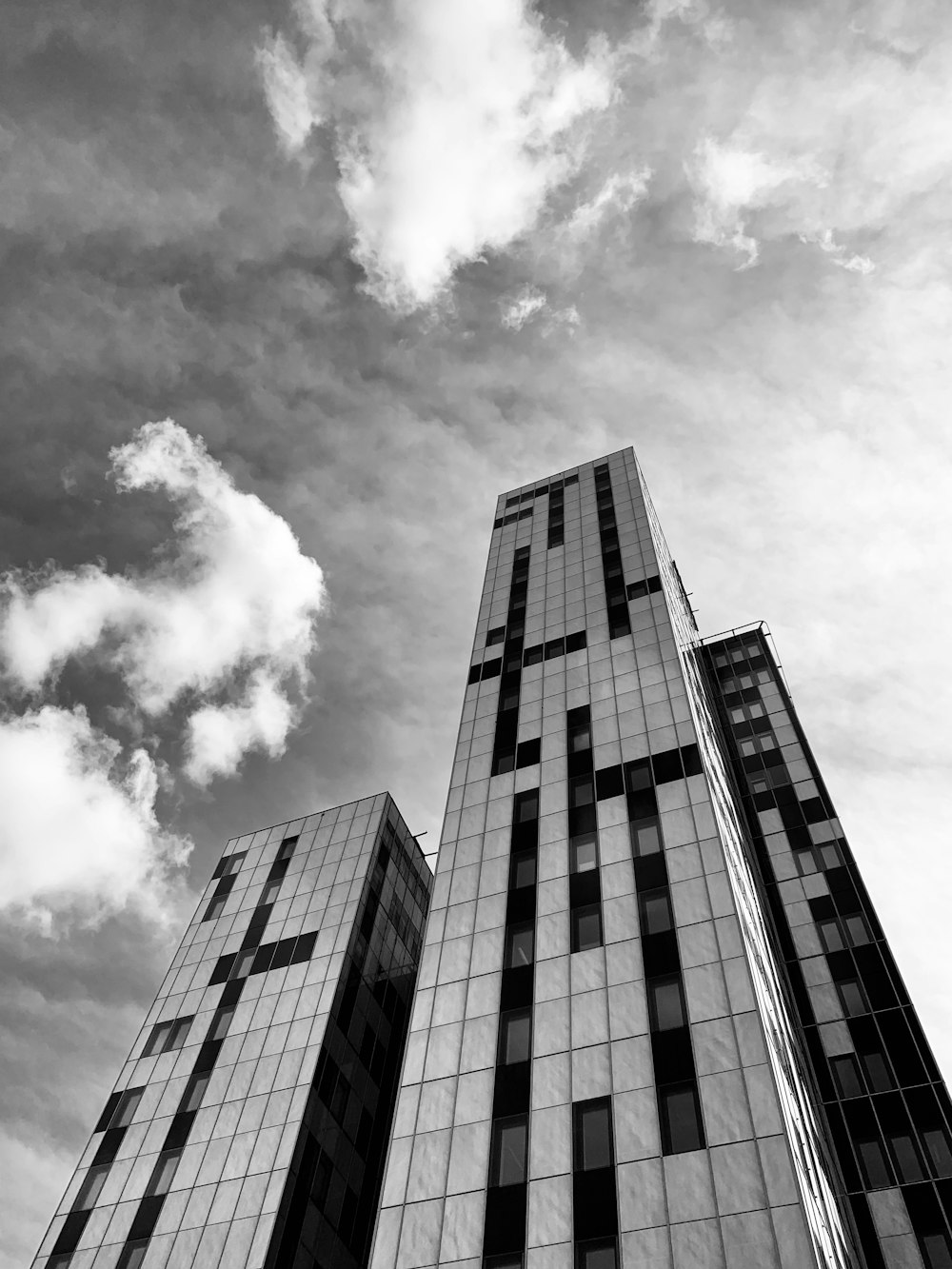 grayscale photography of high-rise building