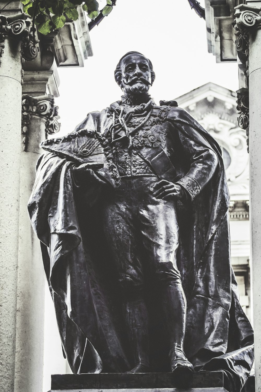 man wearing cape statue