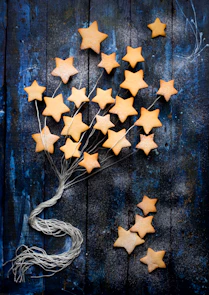 a bunch of star shaped cookies sitting on top of a table