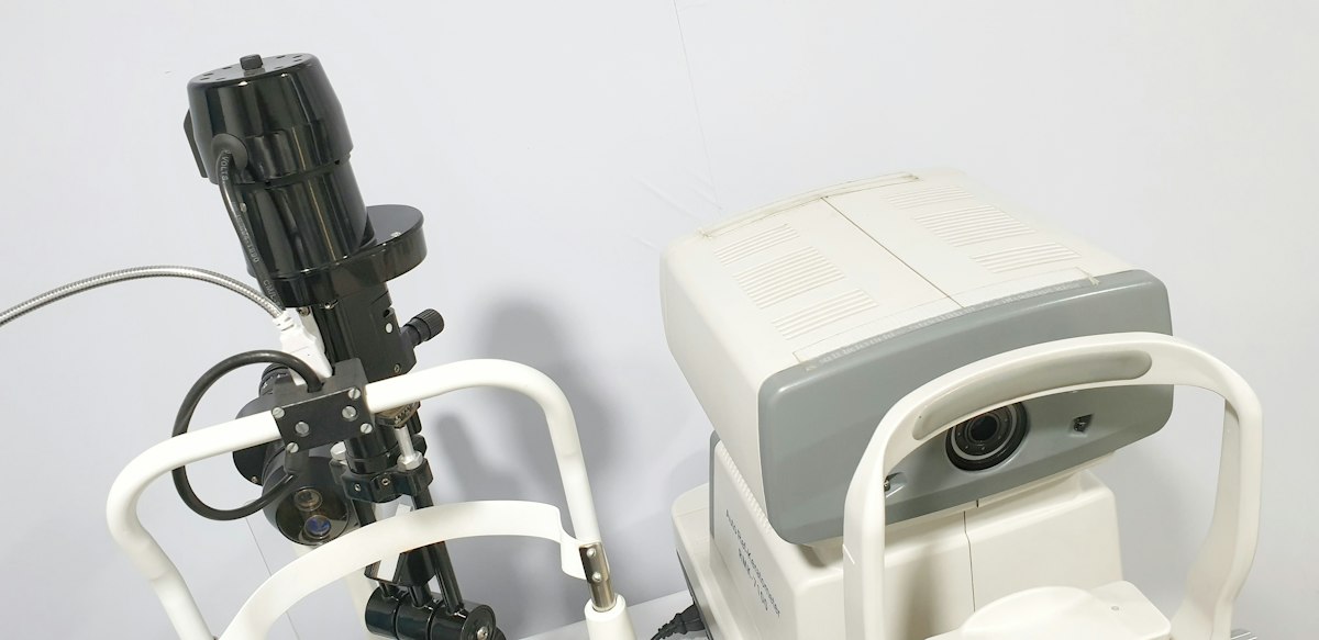 Optometrist reviewing retinal imaging results with a patient