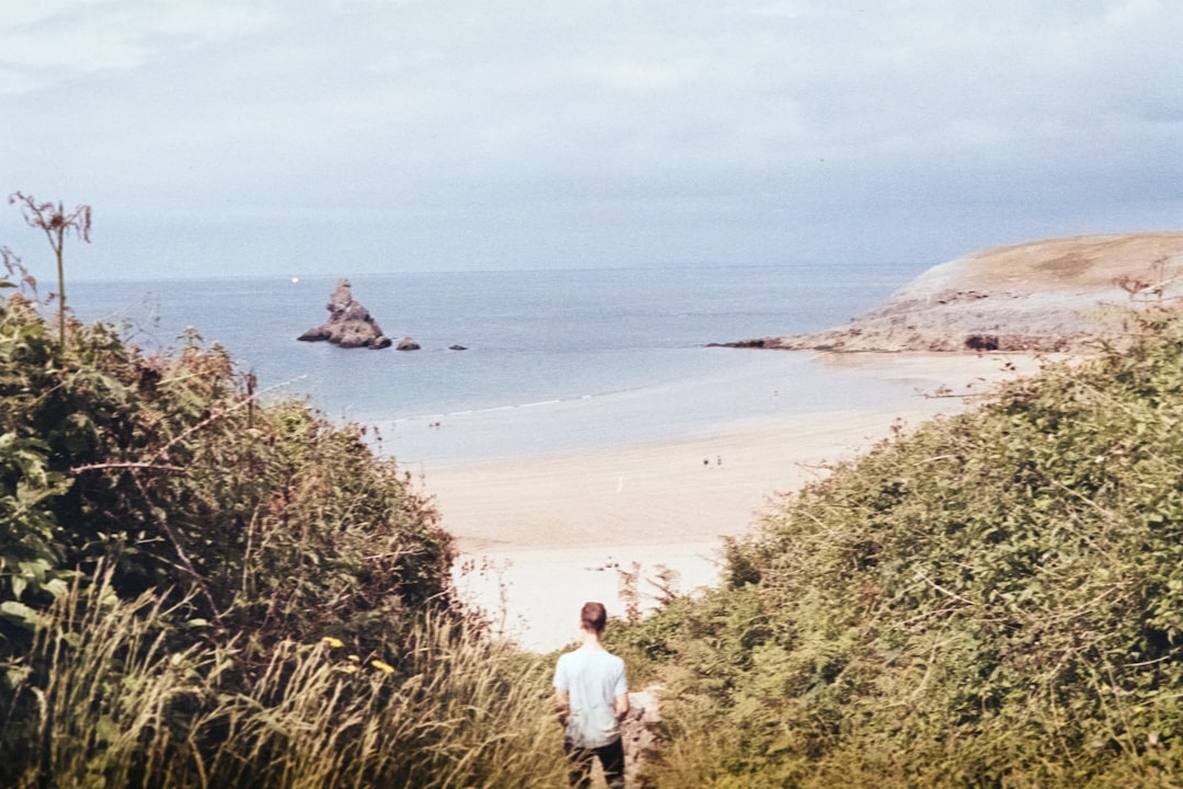 person standing near body of water